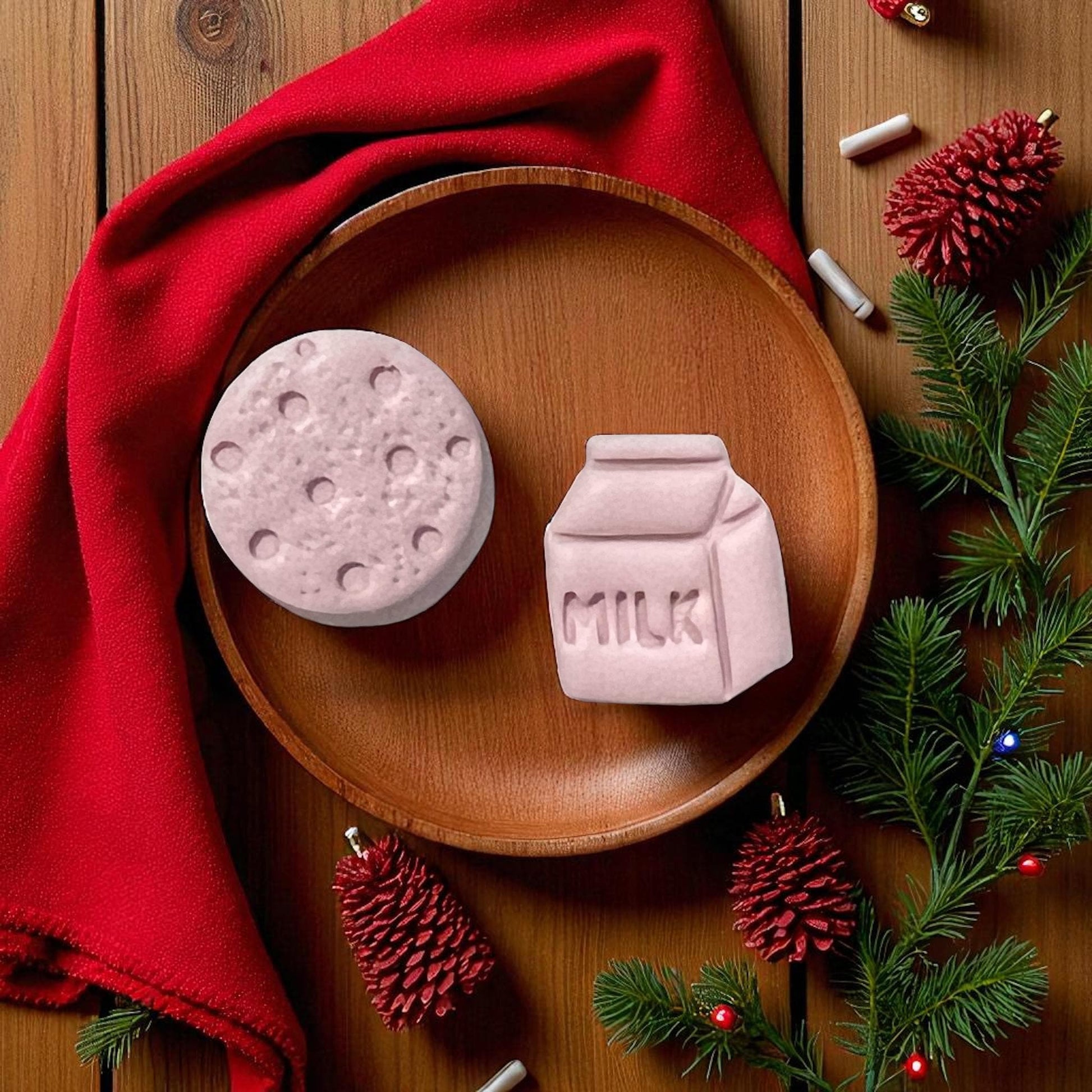 Milk carton and cookie clay pieces on wooden plate with red cloth