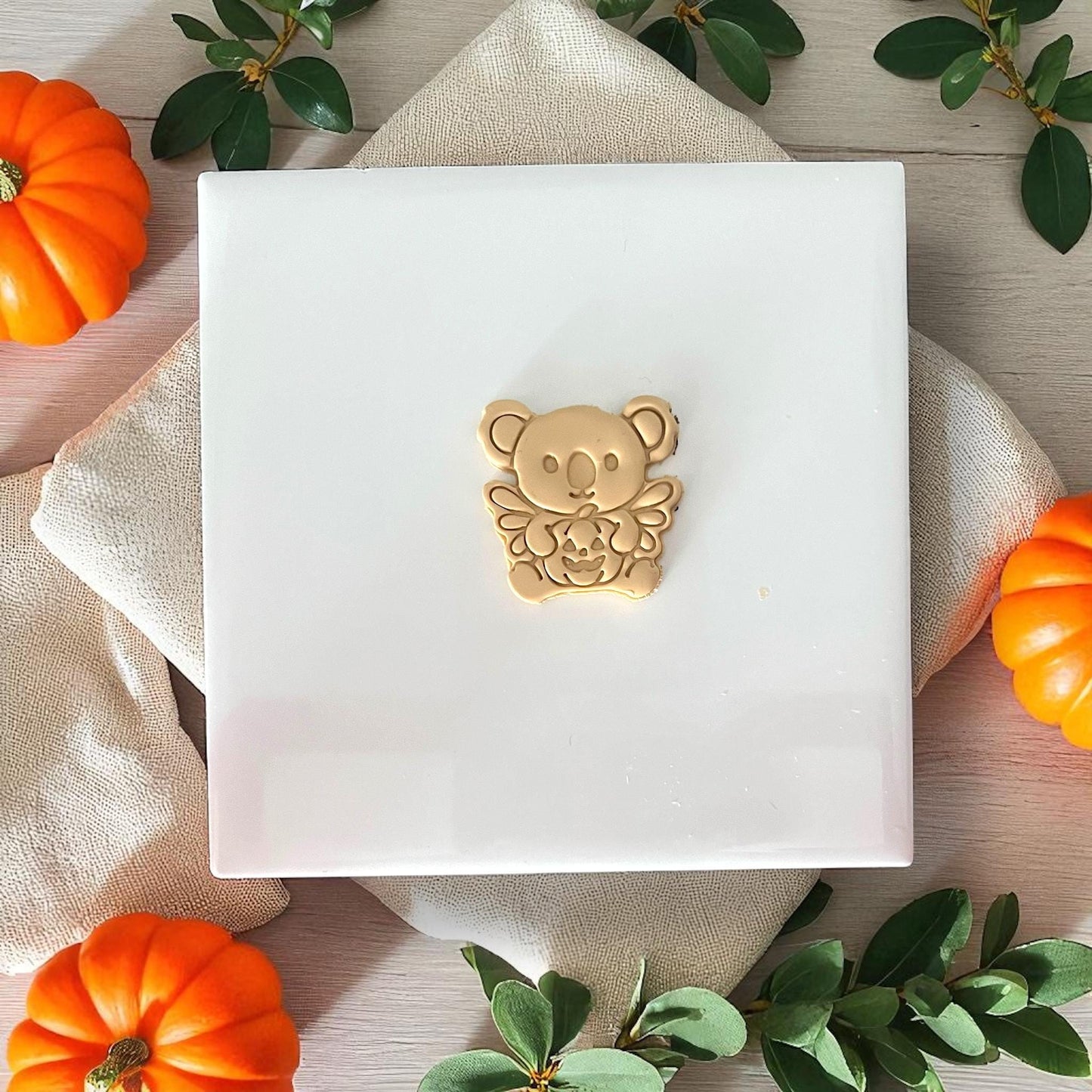 Finished golden koala with pumpkin clay piece