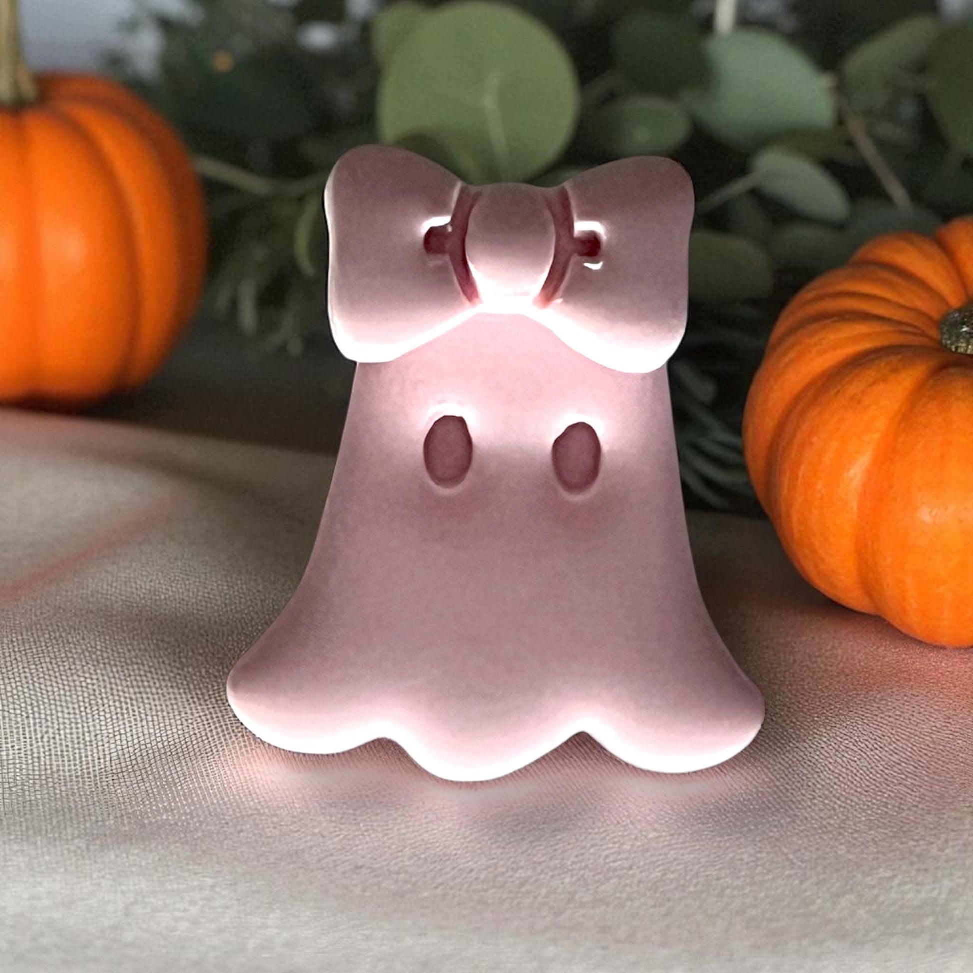 Cute ghost clay piece standing upright with bow