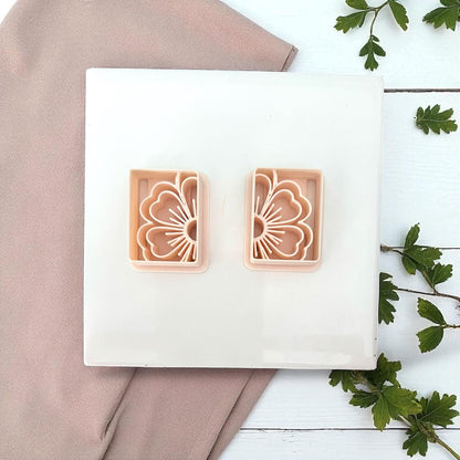 Rectangular floral polymer clay cutters on white tile