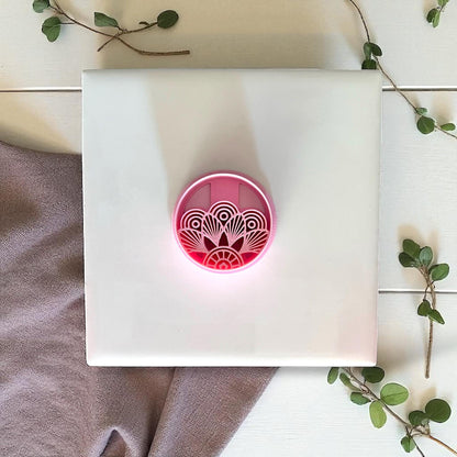 Circular Art Deco clay imprint pressed into clay sheet