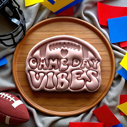 Large clay cutout with football game day vibes letters on plate