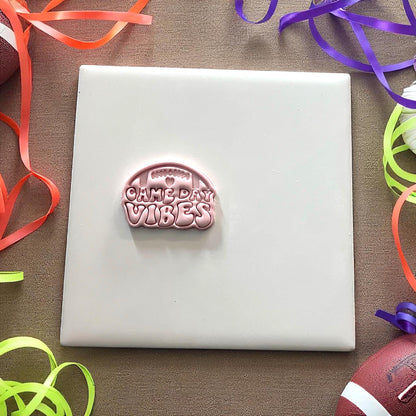 Small football game day vibes clay imprint on tile with rainbow ribbons