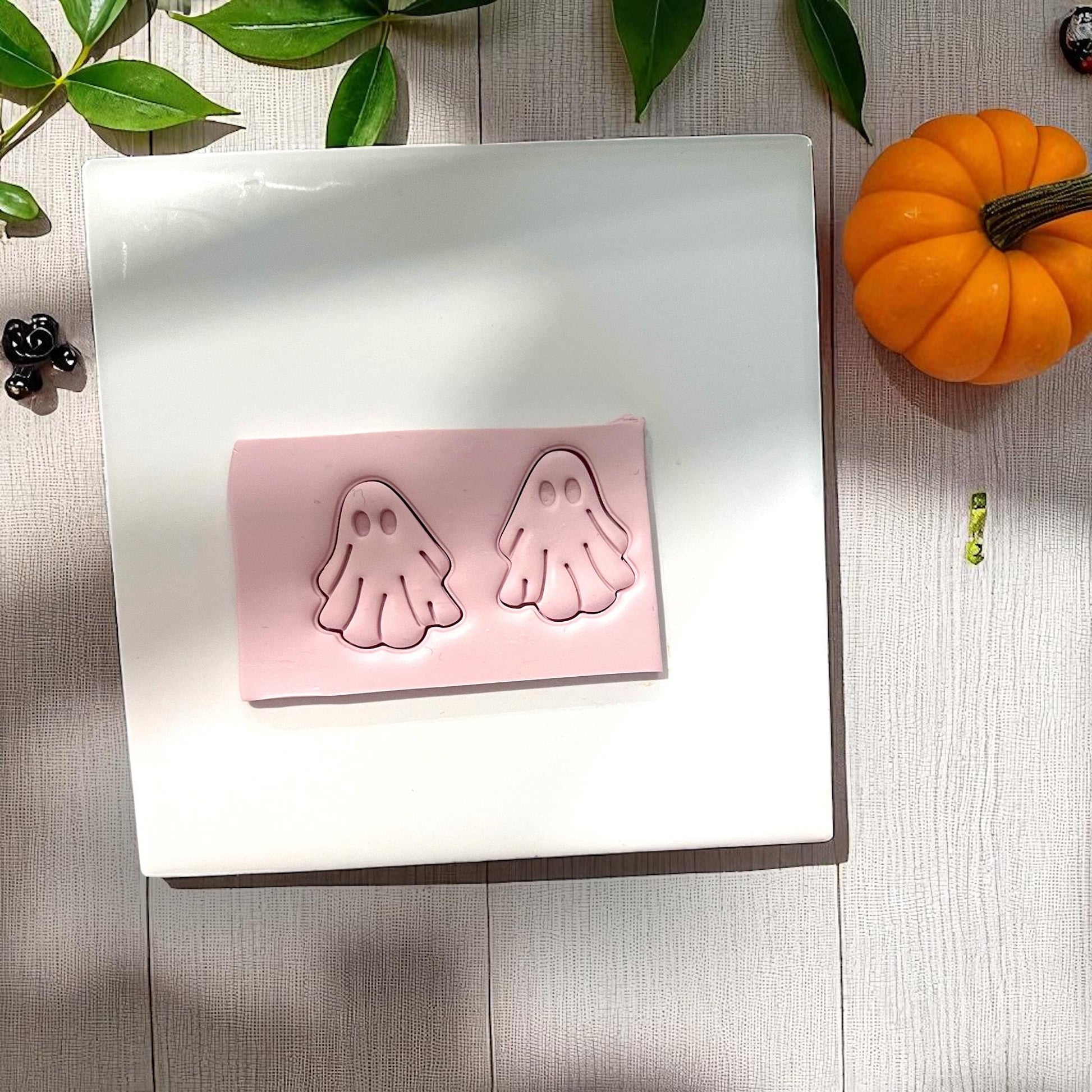 Pink clay slab with ghost impressions and pumpkin nearby