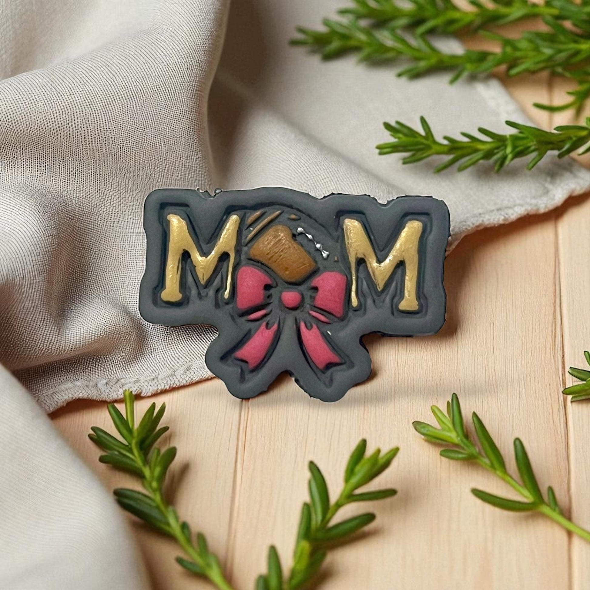 Football mom clay piece with bow in black, gold, and red