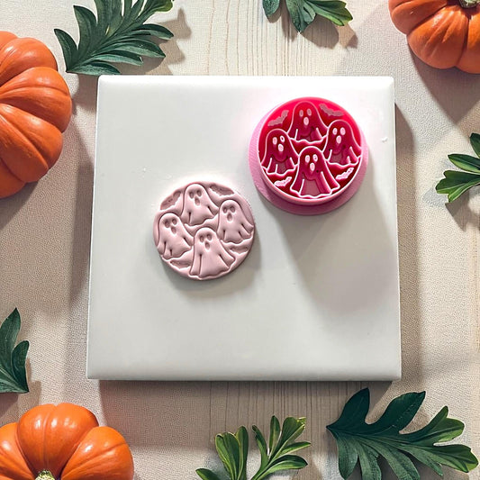 Pink clay ghost circle cutter with clay impression on white tile