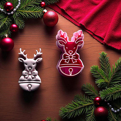 Reindeer clay imprint and cutter side by side with greenery and ornaments