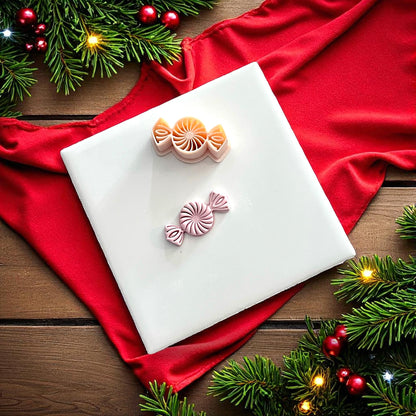 Peppermint candy clay imprint and cutter on white tile with red fabric and greenery