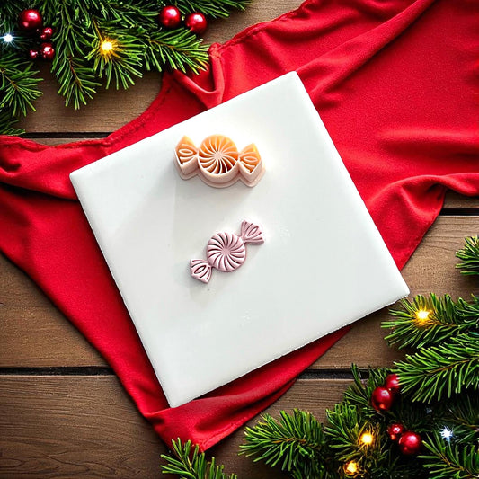 Peppermint candy clay imprint and cutter on white tile with red fabric and greenery