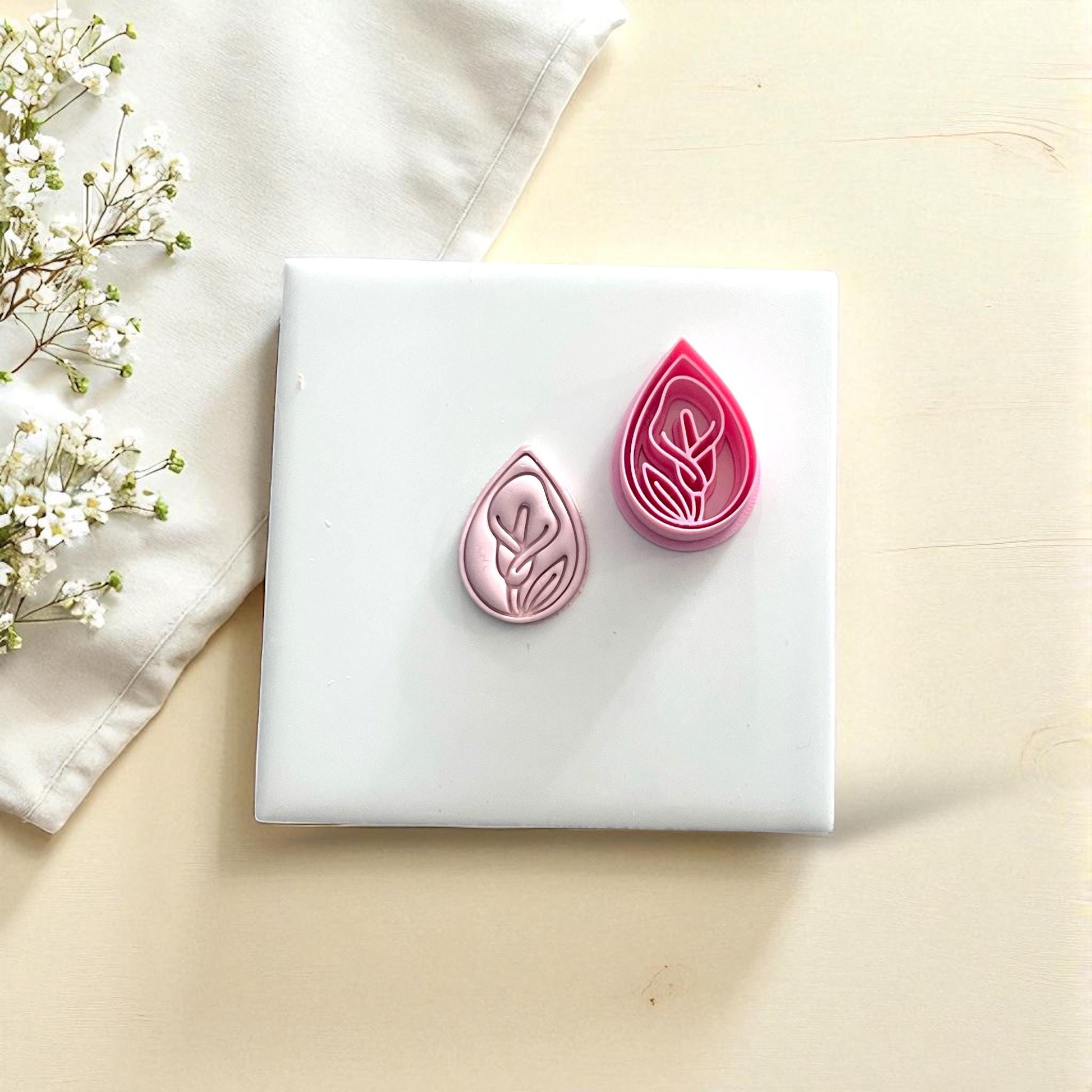 Calla lily clay imprint and cutter set on white tile