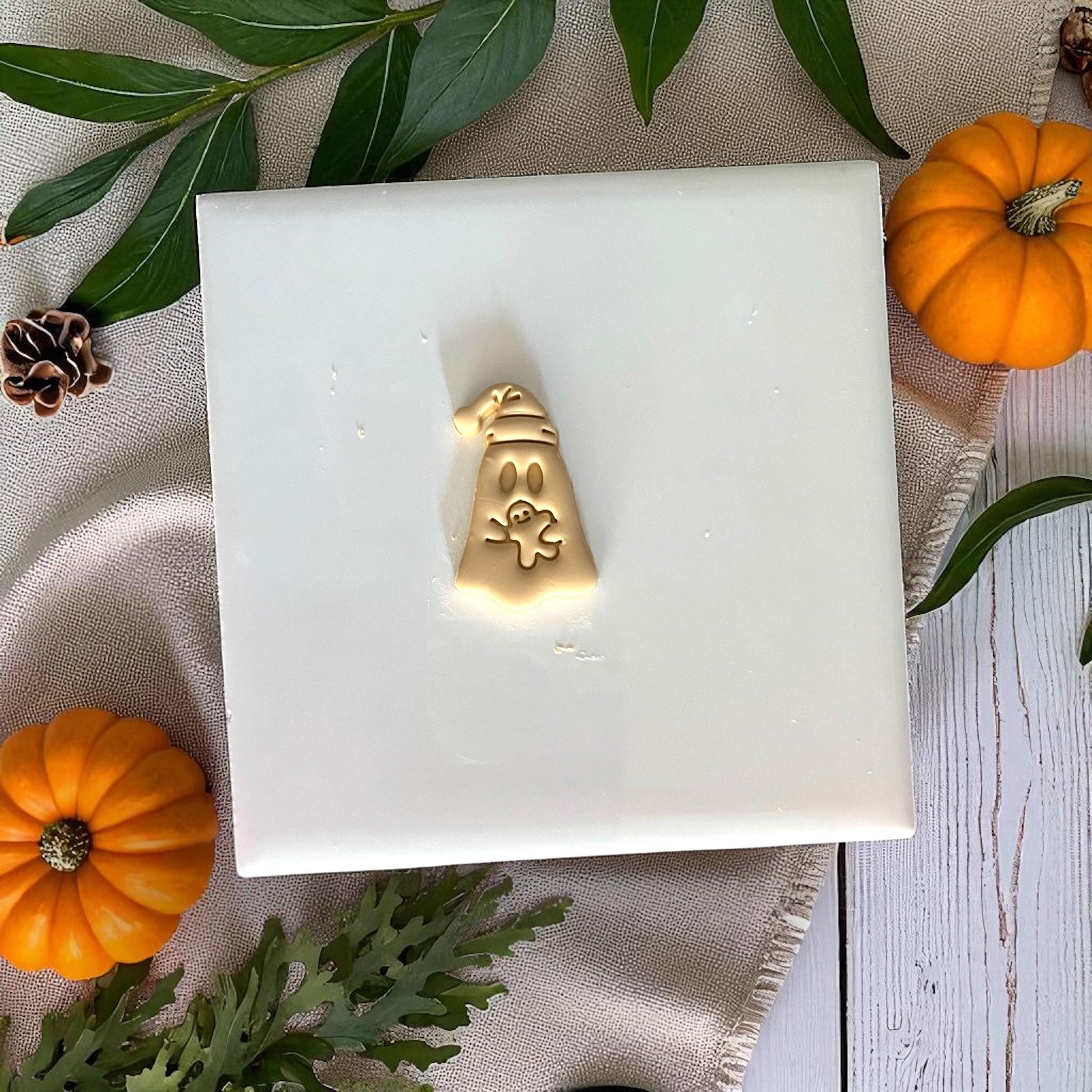 Small sleepy ghost clay design holding teddy bear