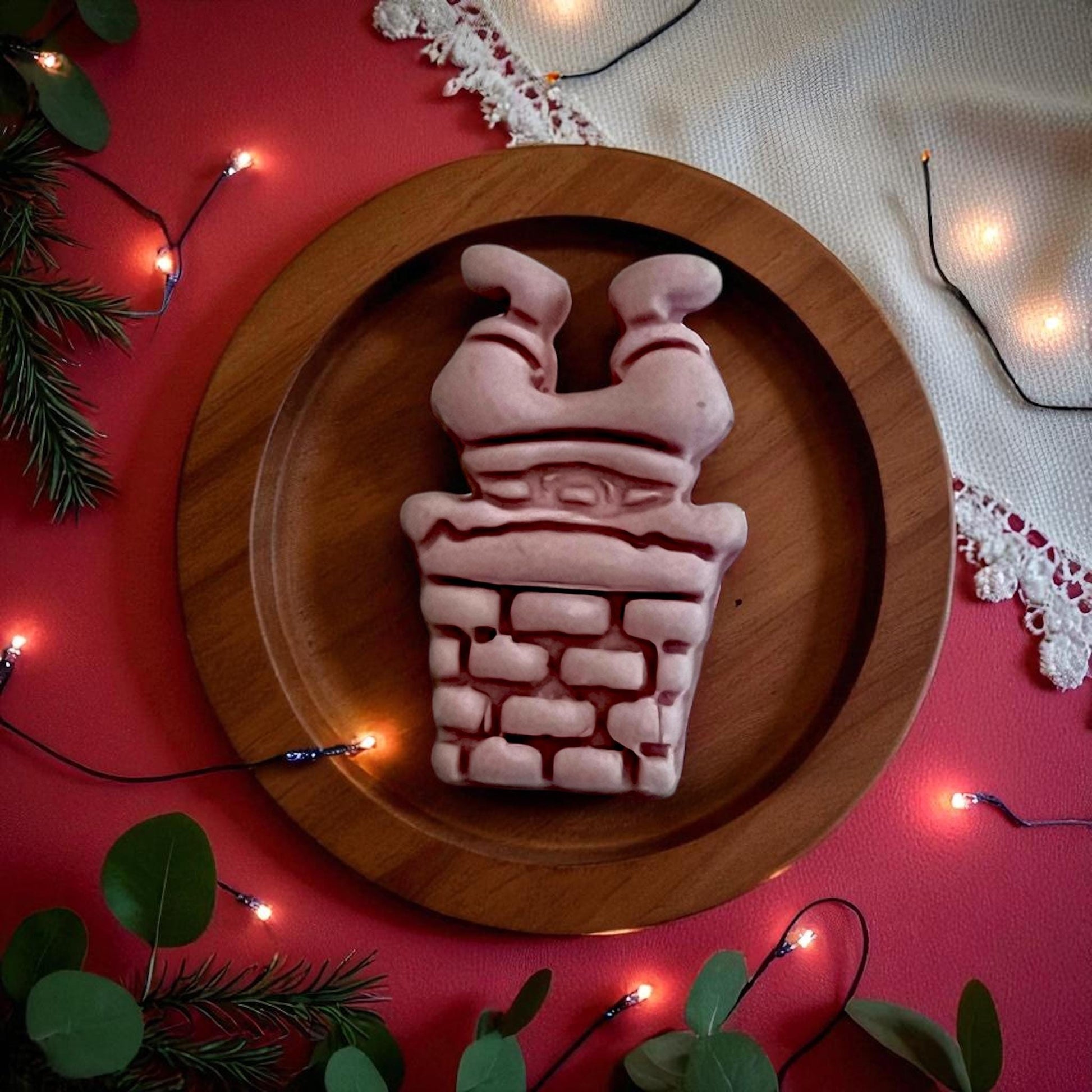 Large Santa in chimney clay imprint on wooden plate with holiday lights