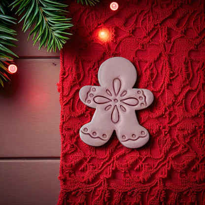 Boho gingerbread man clay piece with center floral snowflake detail
