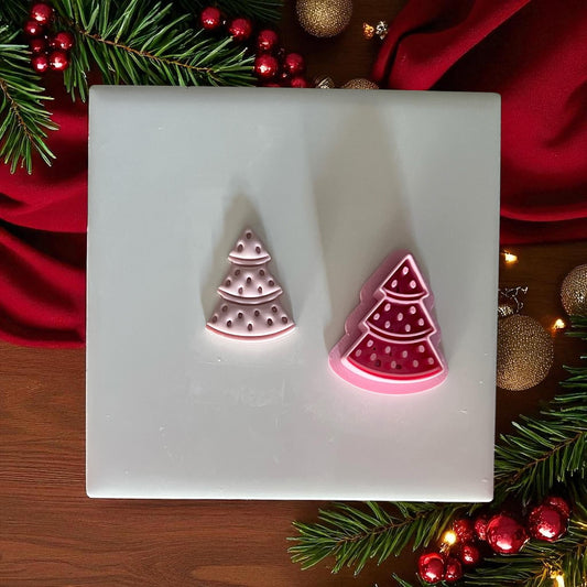 Watermelon tree clay imprint and cutter side by side on white tile