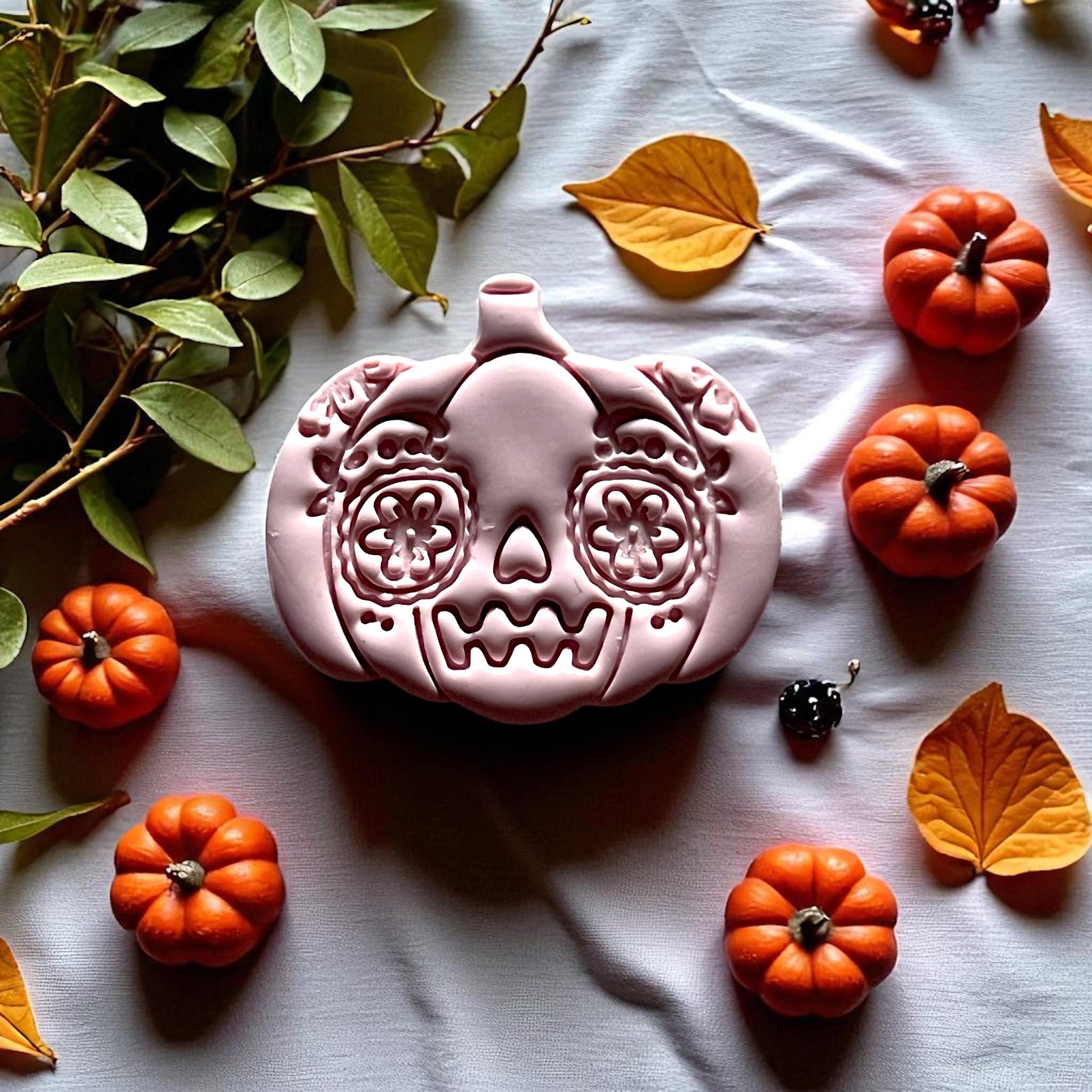 Large sugar skull pumpkin clay imprint on fabric with mini pumpkins