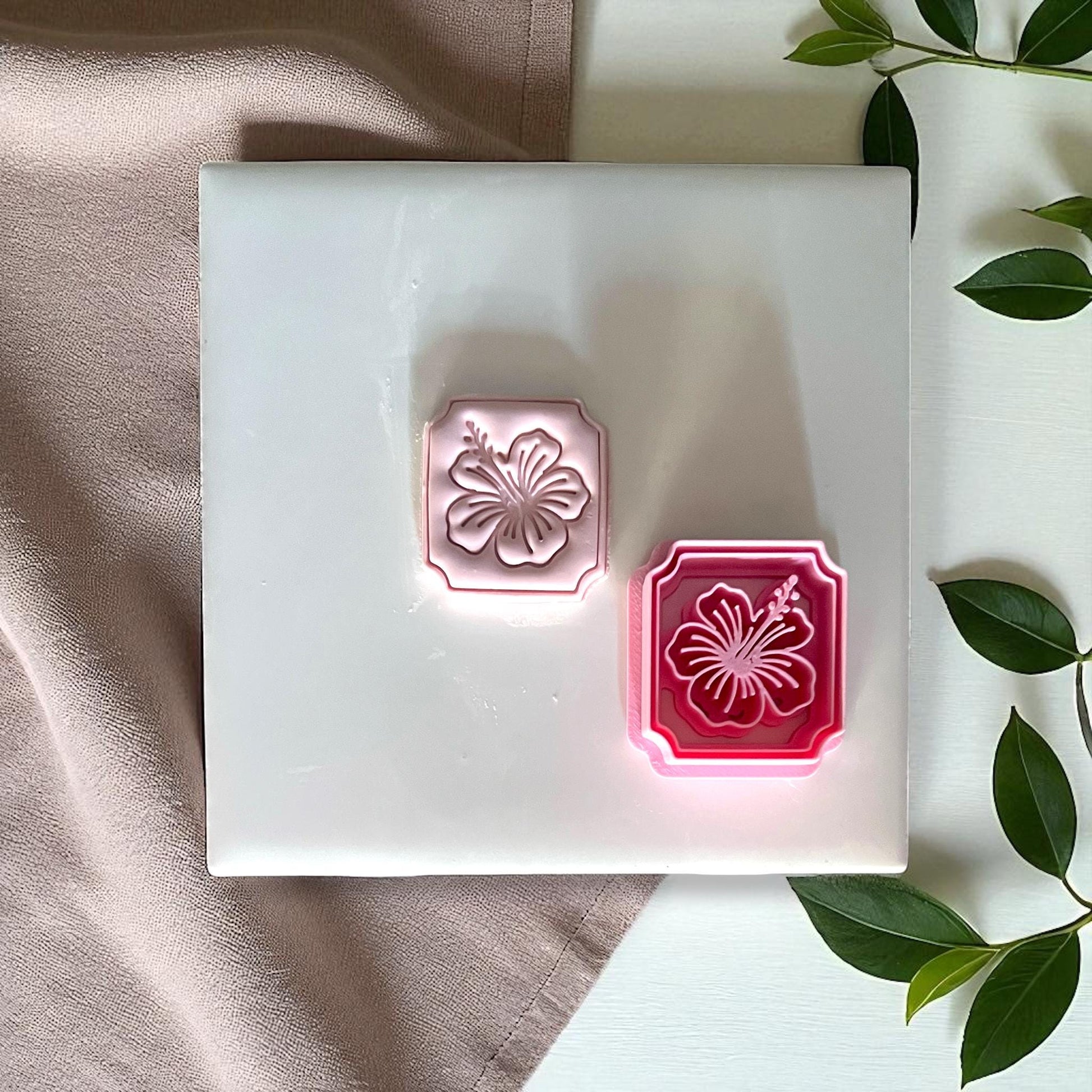 Hibiscus flower clay cutter with matching clay imprint side by side
