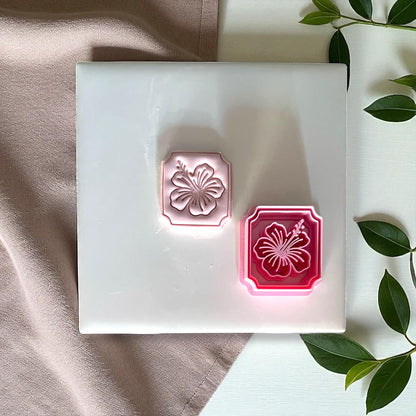 Hibiscus flower clay cutter with matching clay imprint side by side