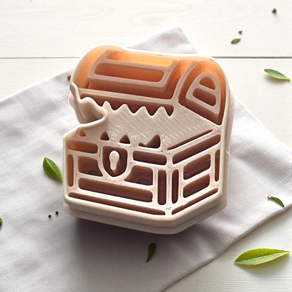 Mimic chest clay impression on white tile with gray napkin and eucalyptus stem