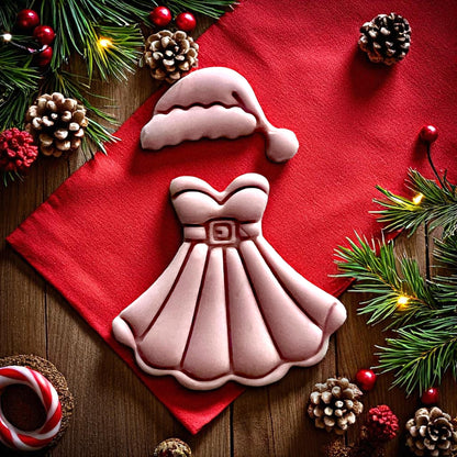 Close-up of Mrs Santa dress and hat clay imprint with pinecones