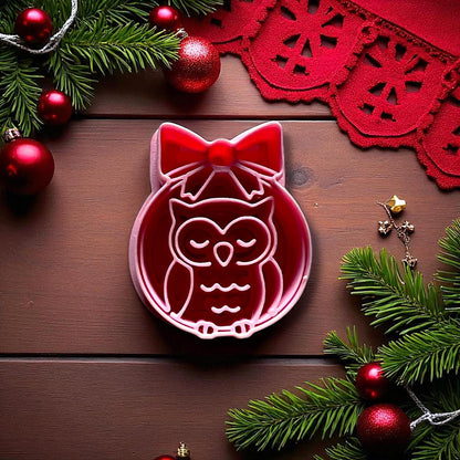 Close-up owl ornament clay cutter with bow and Christmas decor