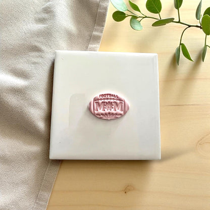 Football mom floral clay imprint on white tile