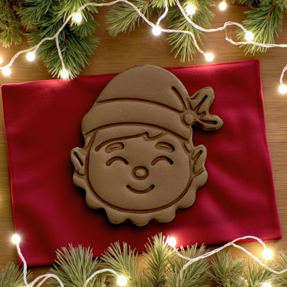Close-up of smiling elf clay imprint with Christmas lights