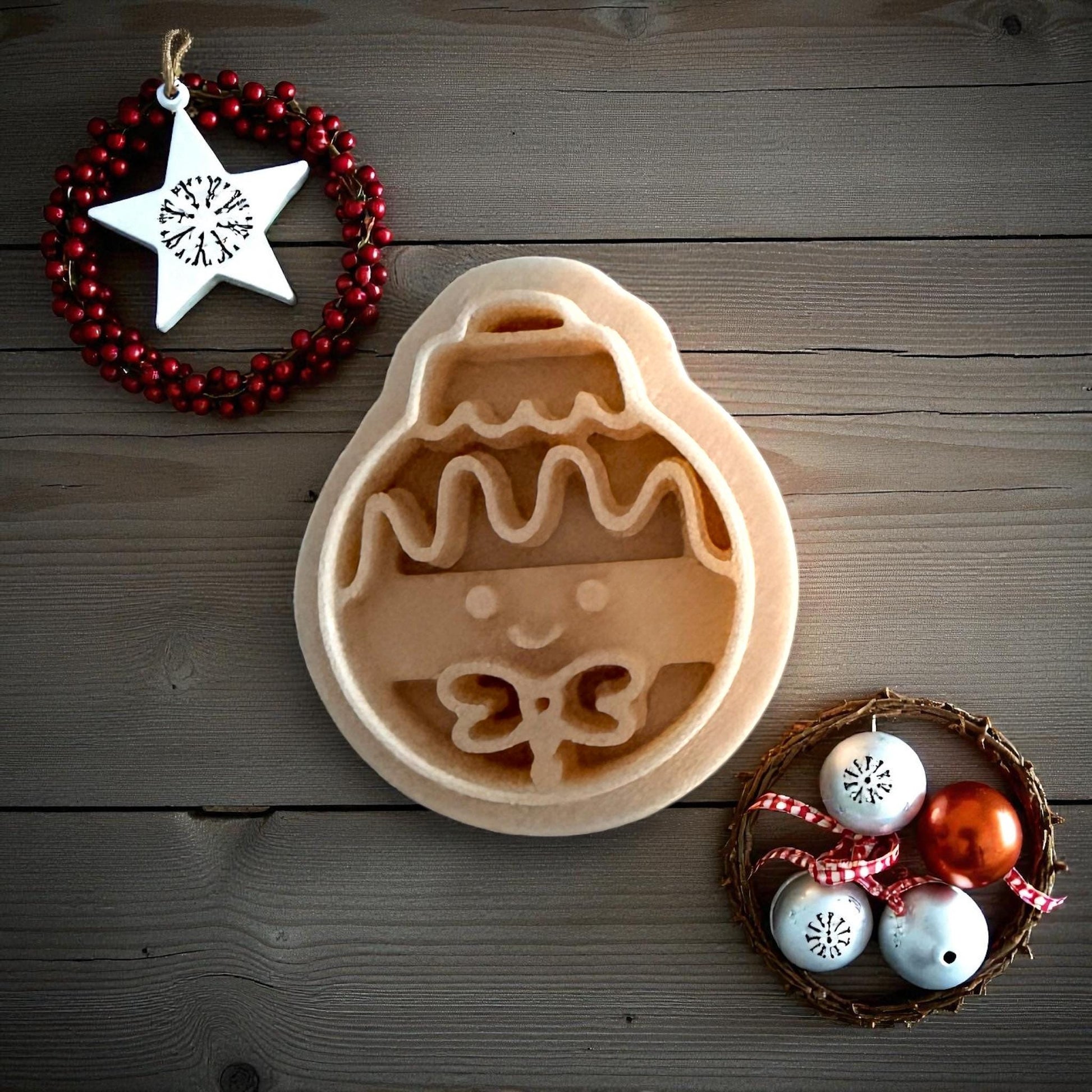 Gingerbread ornament clay imprint on wood background with Christmas decor