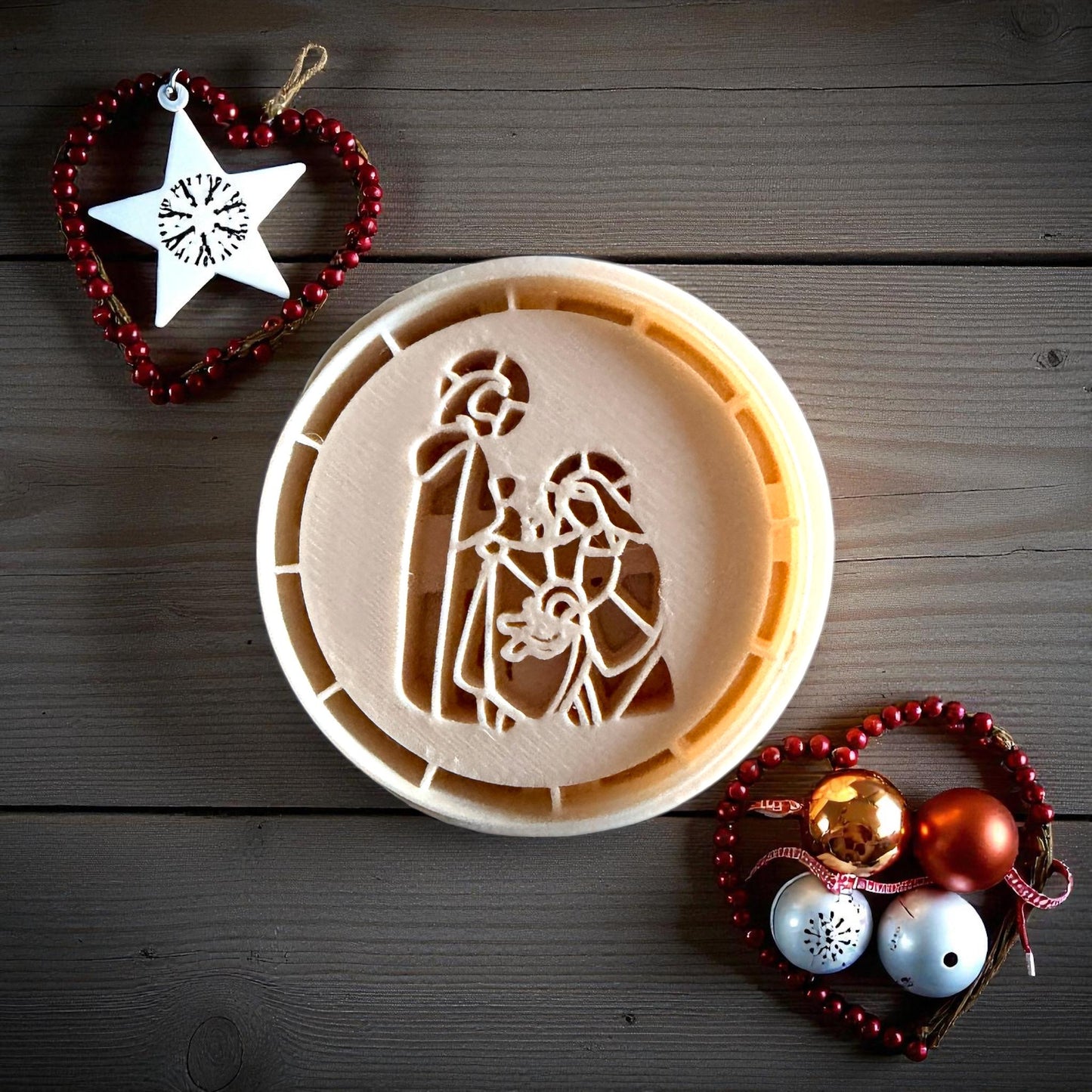 Nativity clay imprint pressed into clay sheet on white tile with festive decor