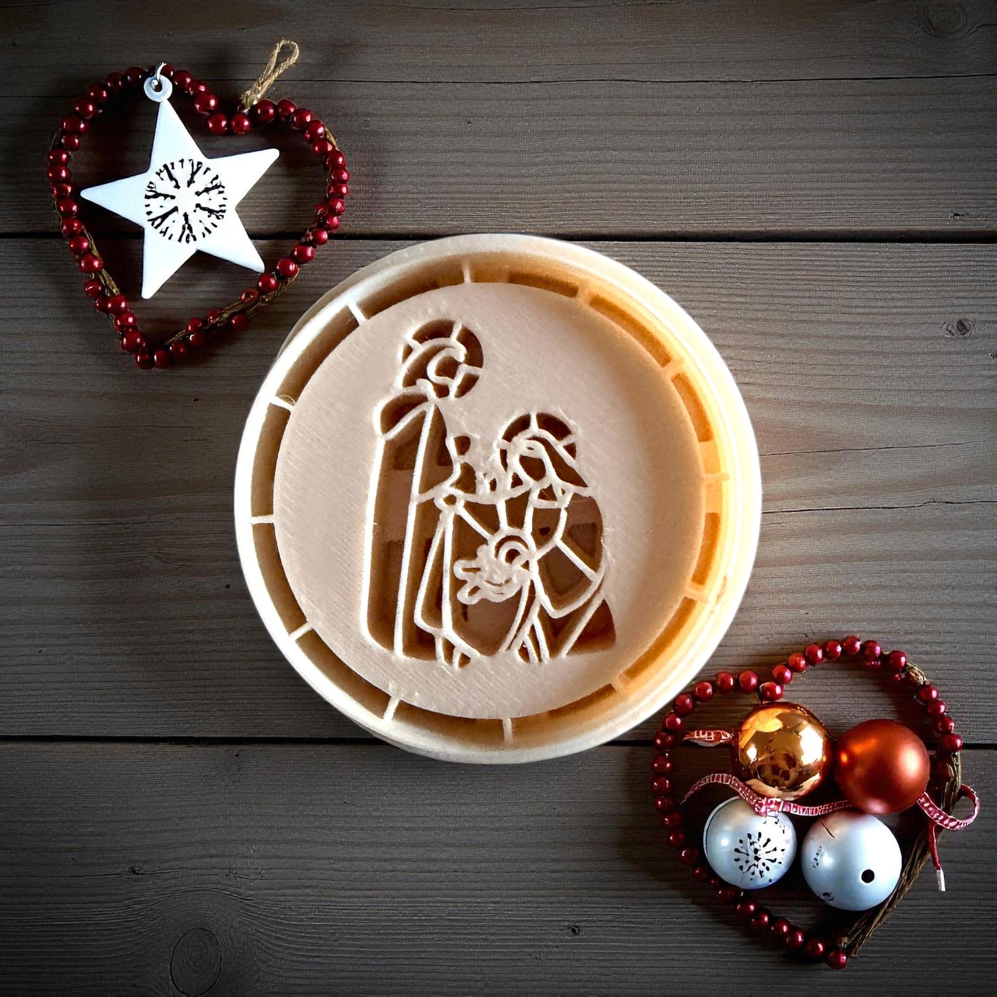 Nativity clay imprint pressed into clay sheet on white tile with festive decor