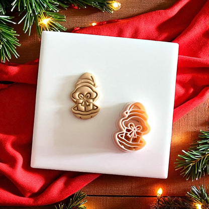 Clay cutter and impression of oyster with present displayed on festive backdrop