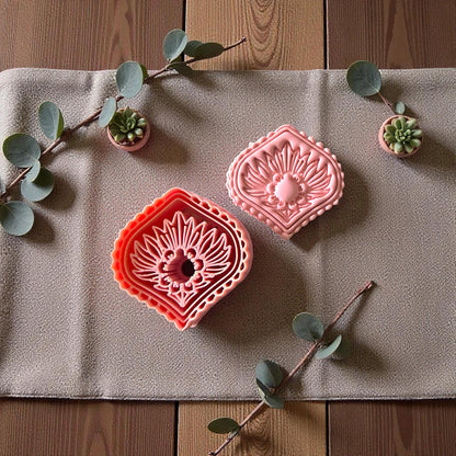 Diamond Art Deco floral cutter and pink clay imprint on linen with succulents and eucalyptus