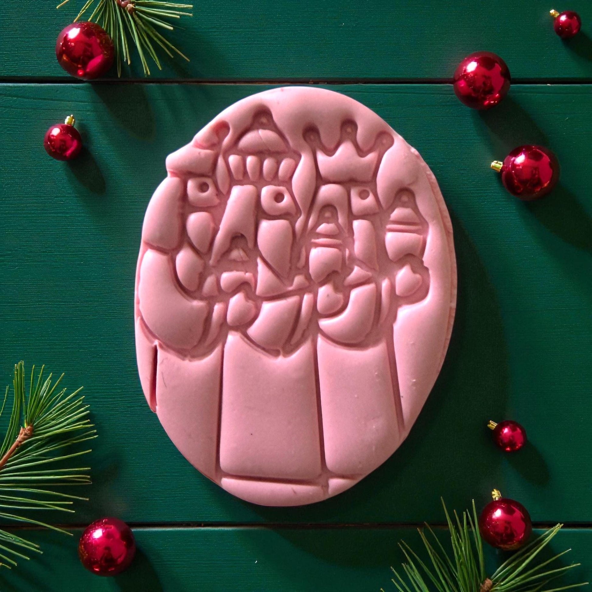 Pink Three Kings clay imprint with holiday ornaments and greenery