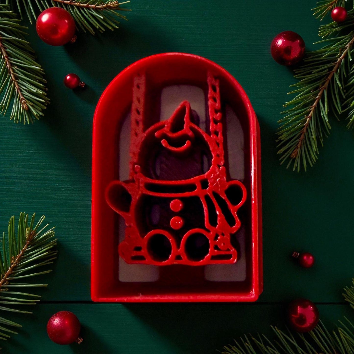 Red snowman on swing polymer clay cutter with pine branches and ornaments
