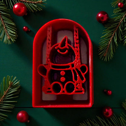 Red snowman on swing polymer clay cutter with pine branches and ornaments