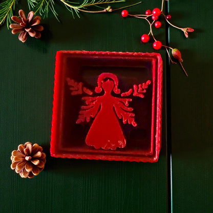 Close-up of red angel cutter showing detailed wings and square frame