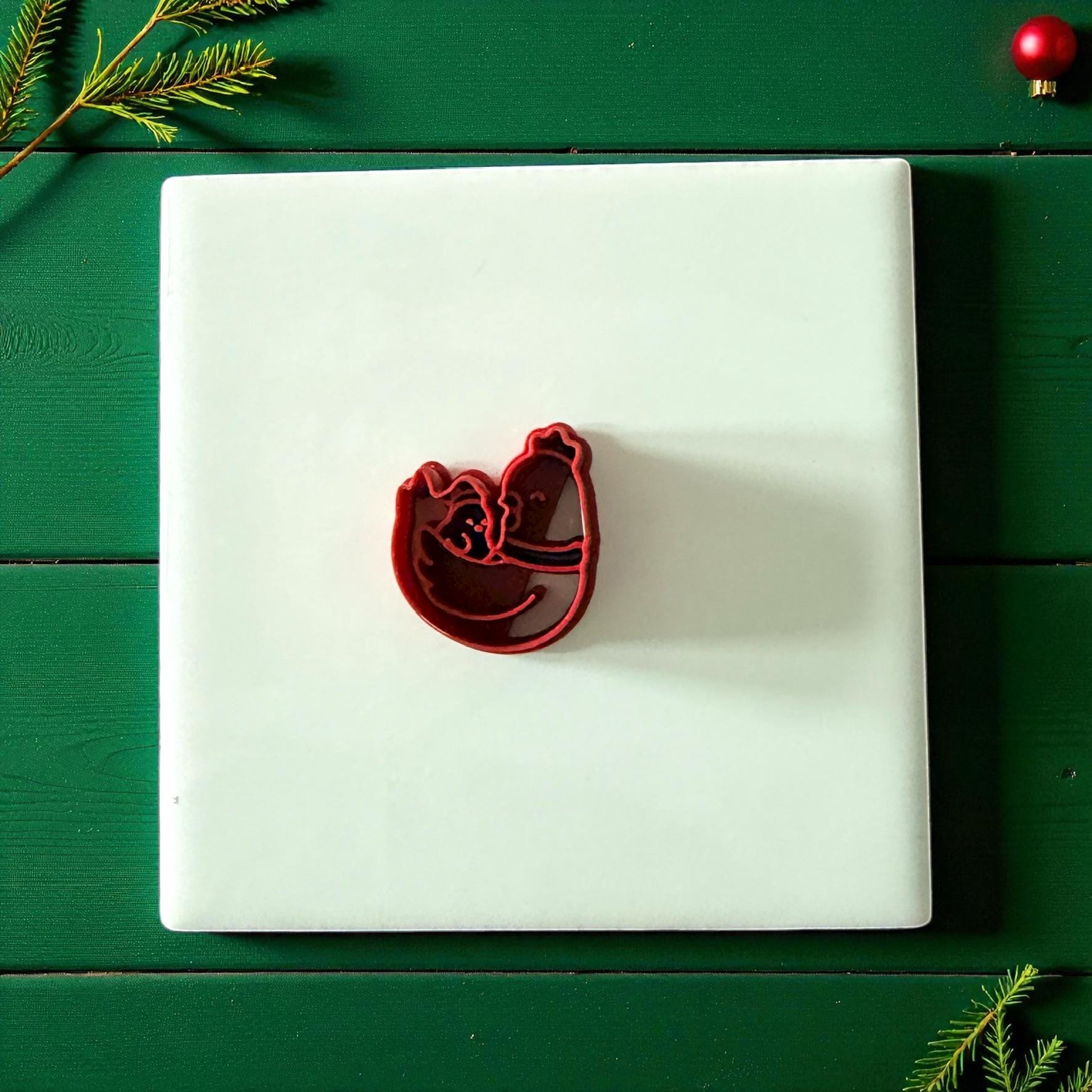 Chicken family clay cutter centered on white tile with green background
