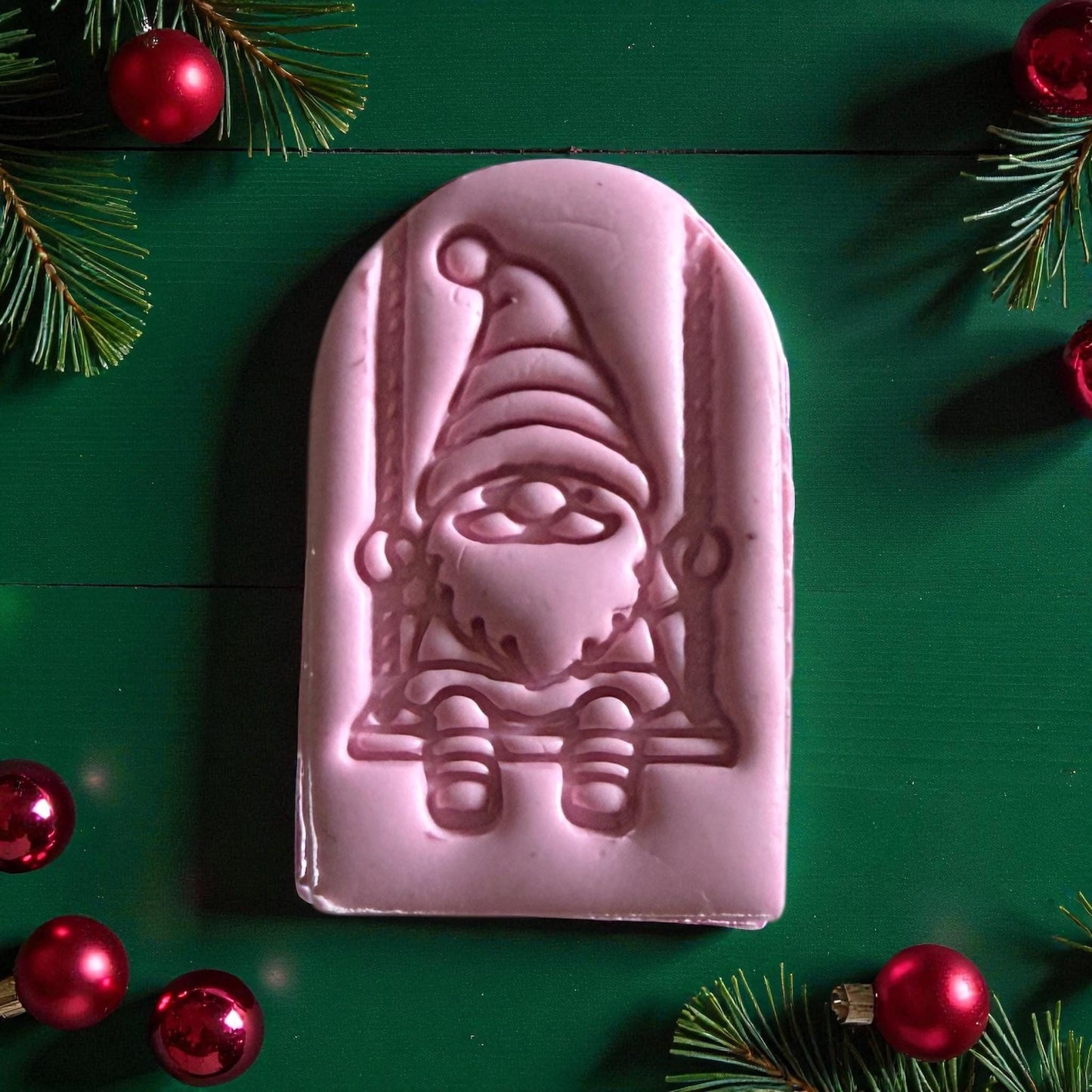 Close-up of pink gnome clay piece showing arched swing details