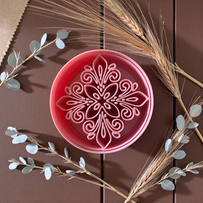Pink round floral polymer clay cutter with boho medallion pattern and dried wheat stems