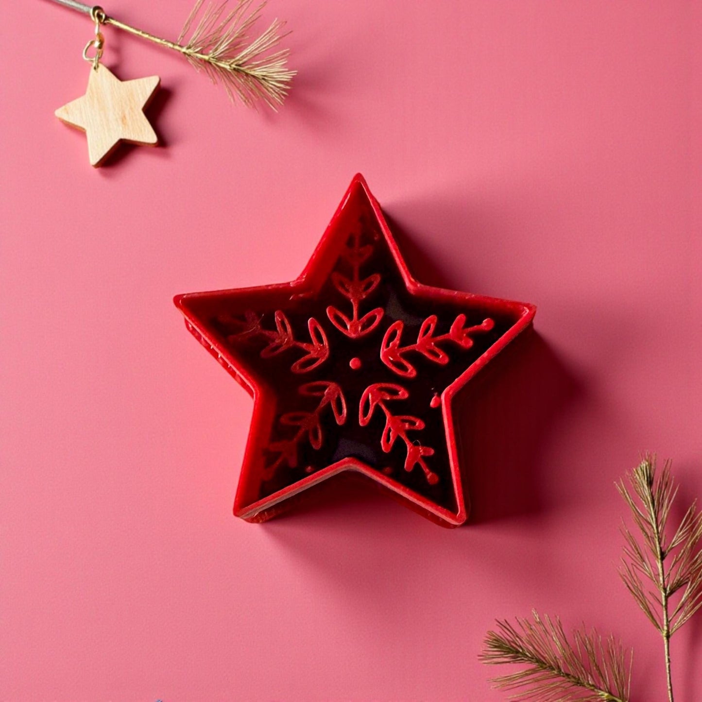 Red Scandinavian-style polymer clay star cutter with wooden star ornament