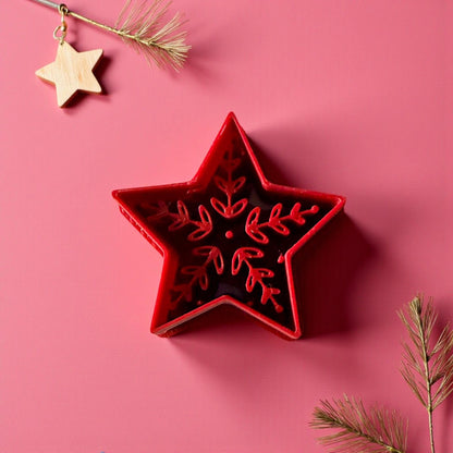 Red Scandinavian-style polymer clay star cutter with wooden star ornament