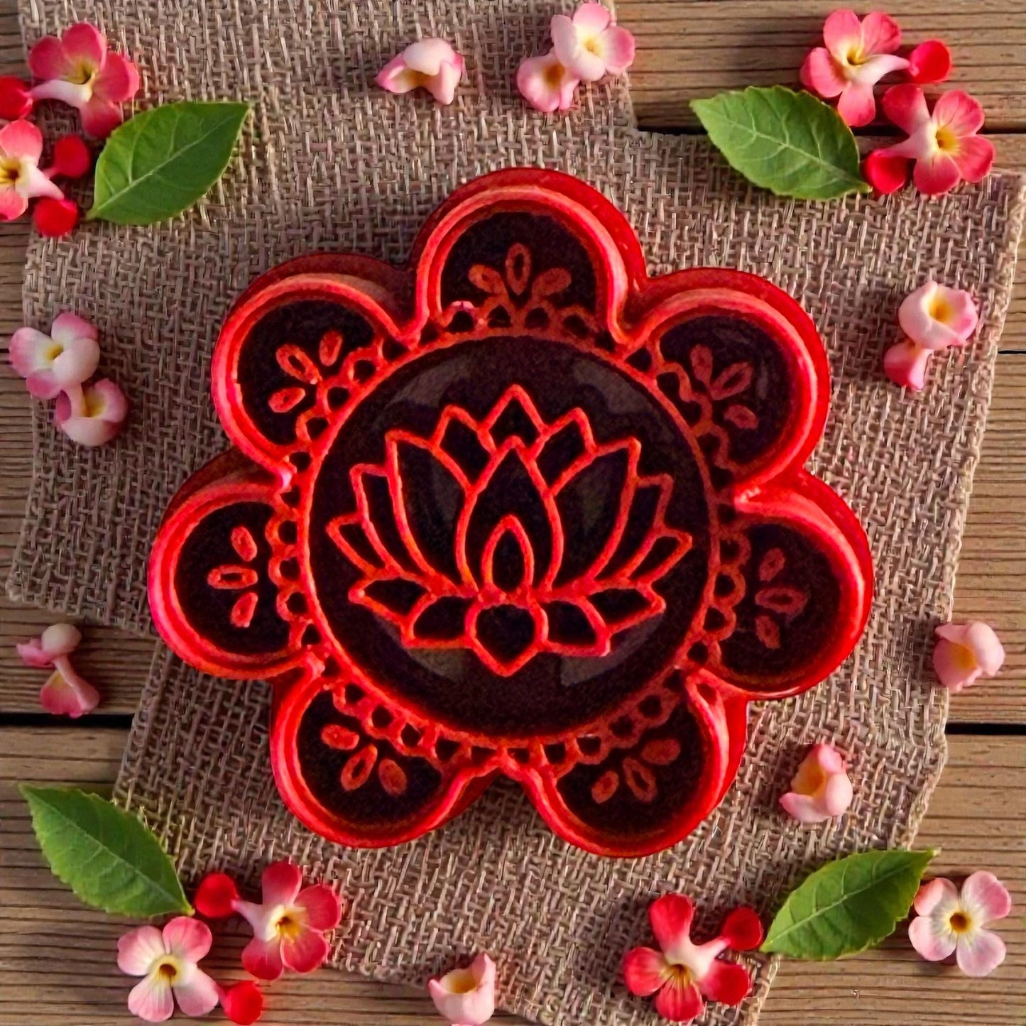 Red lotus mandala polymer clay cutter with floral pattern surrounded by flowers and leaves