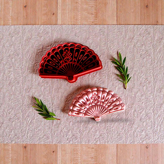 Red and pink floral fan cutters side by side with greenery