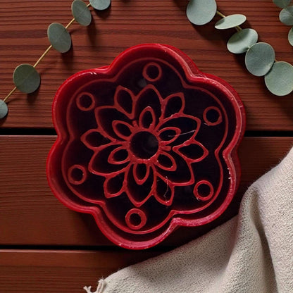 Close-up of red boho floral clay cutter showing detailed petal pattern