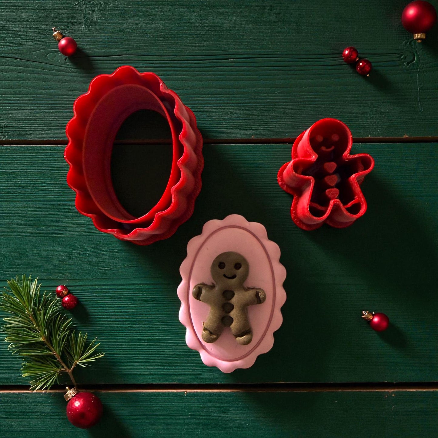 Red cutters with pink clay cameo featuring green gingerbread design