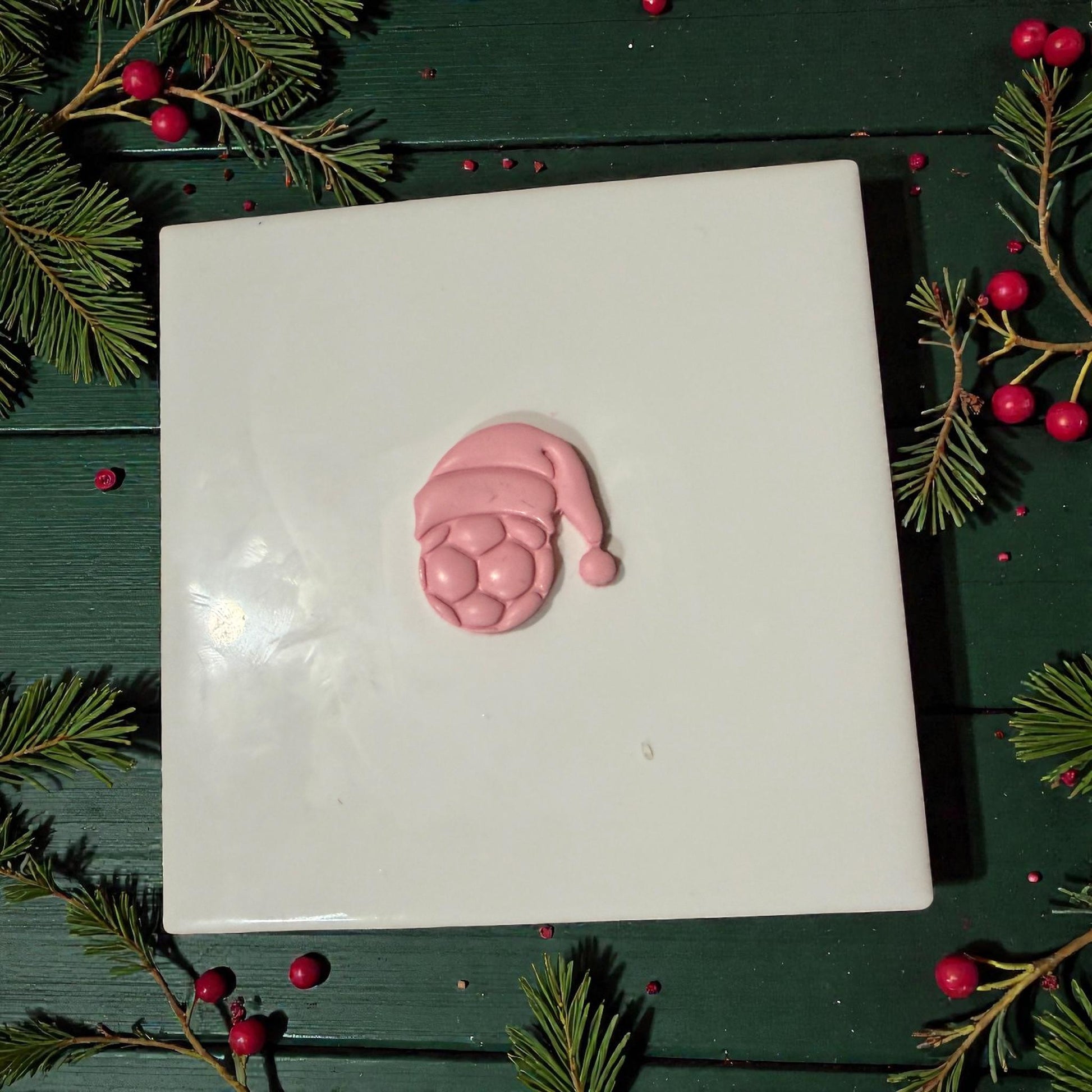pink soccer santa hat impression centered on tile