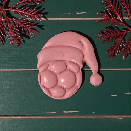 closeup of pink soccer santa hat clay piece