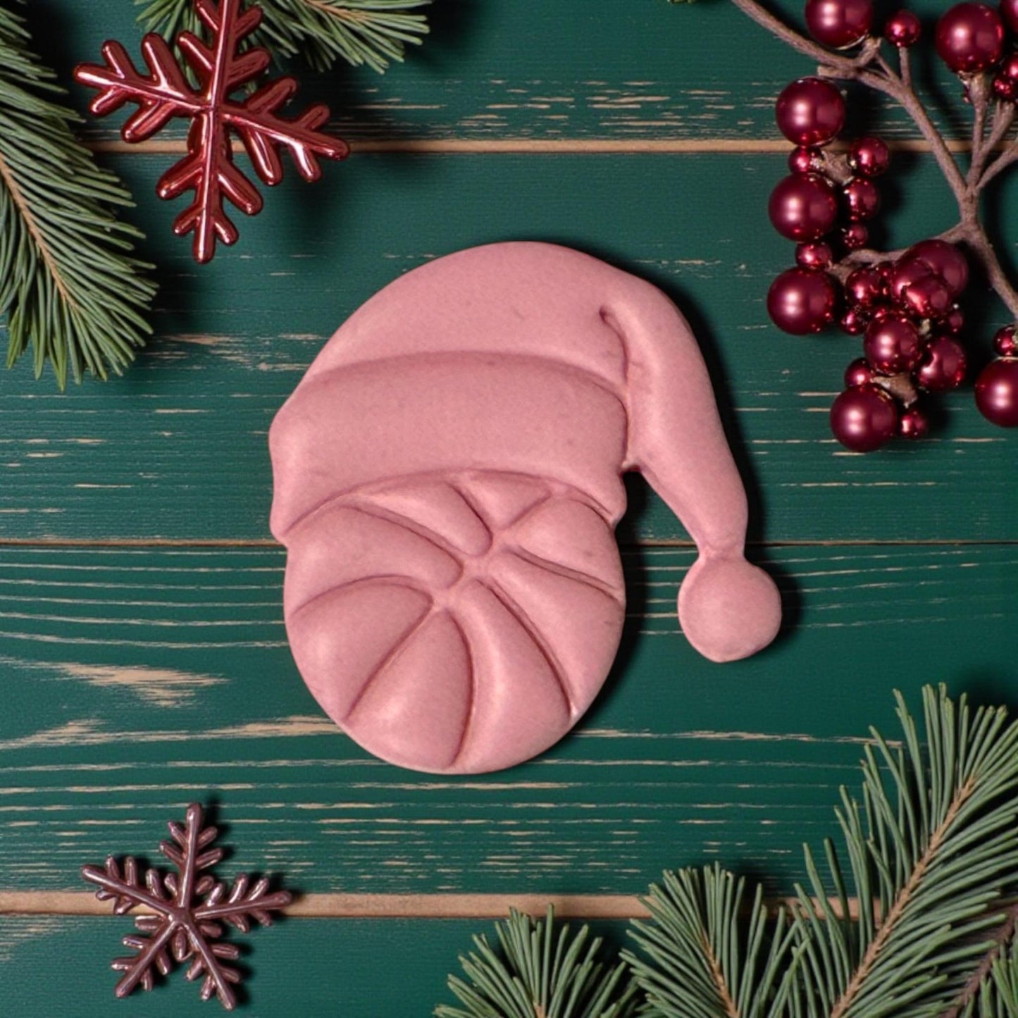 closeup pink basketball santa impression on green background