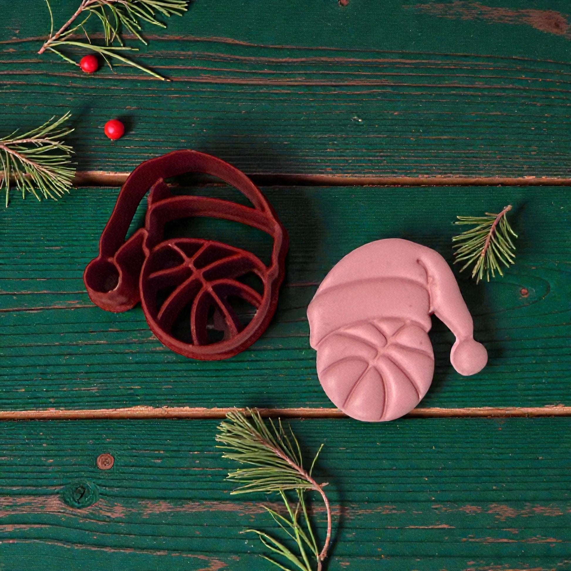 basketball santa cutter and clay piece on green wood