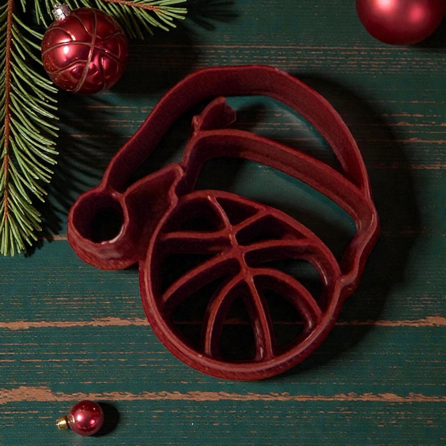 basketball santa hat polymer clay cutter on wooden green table