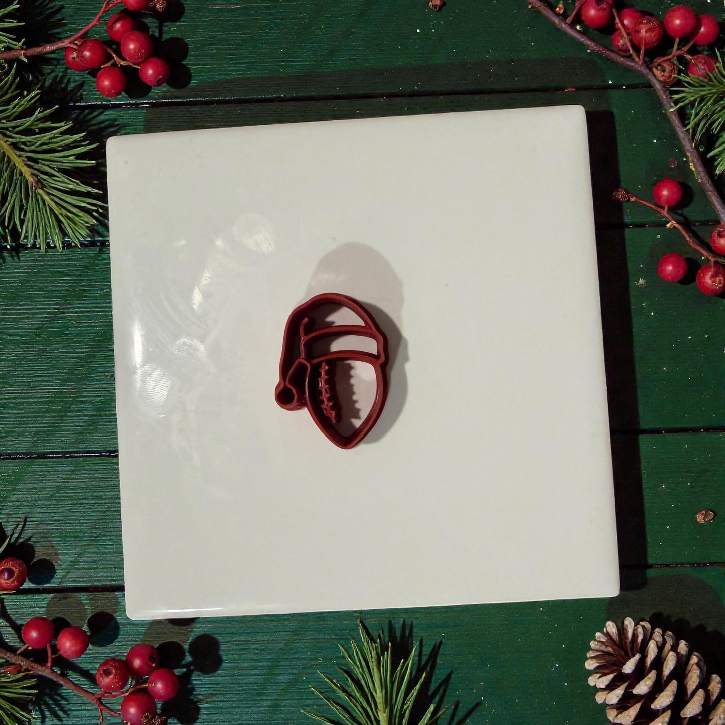 football santa hat polymer clay cutter on white tile